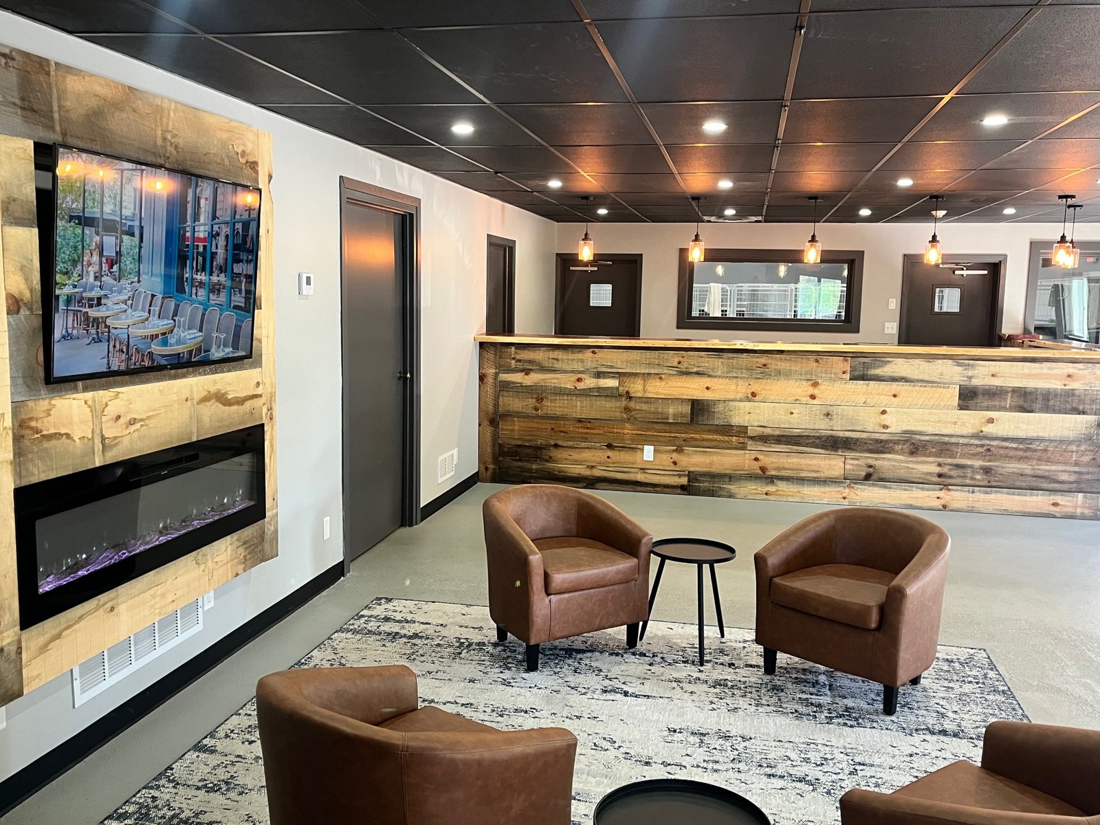 Lobby seating with leather chairs and fireplace
